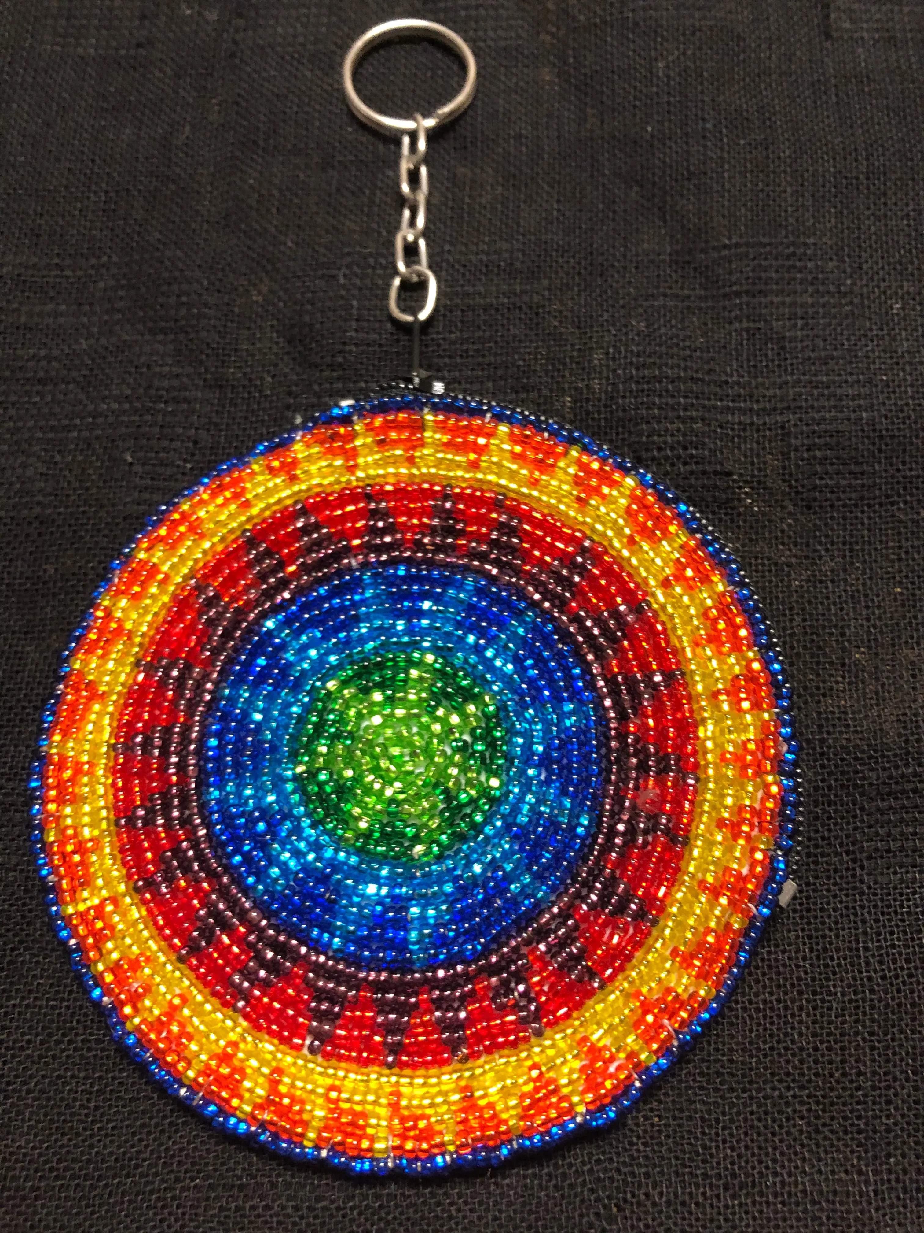 Guatemalan handcrafted glass bead round change purse with key ring. 3.5” diameter.