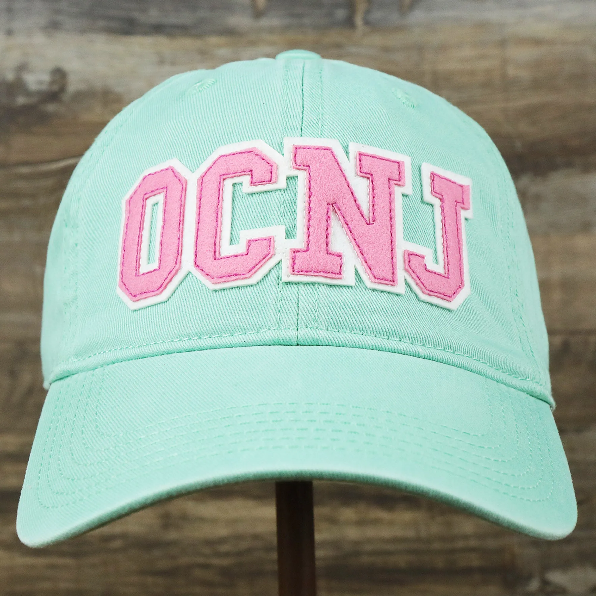 Youth Pink OCNJ Wordmark White Outline Dad Hat | Spearmint Youth Dad Hat