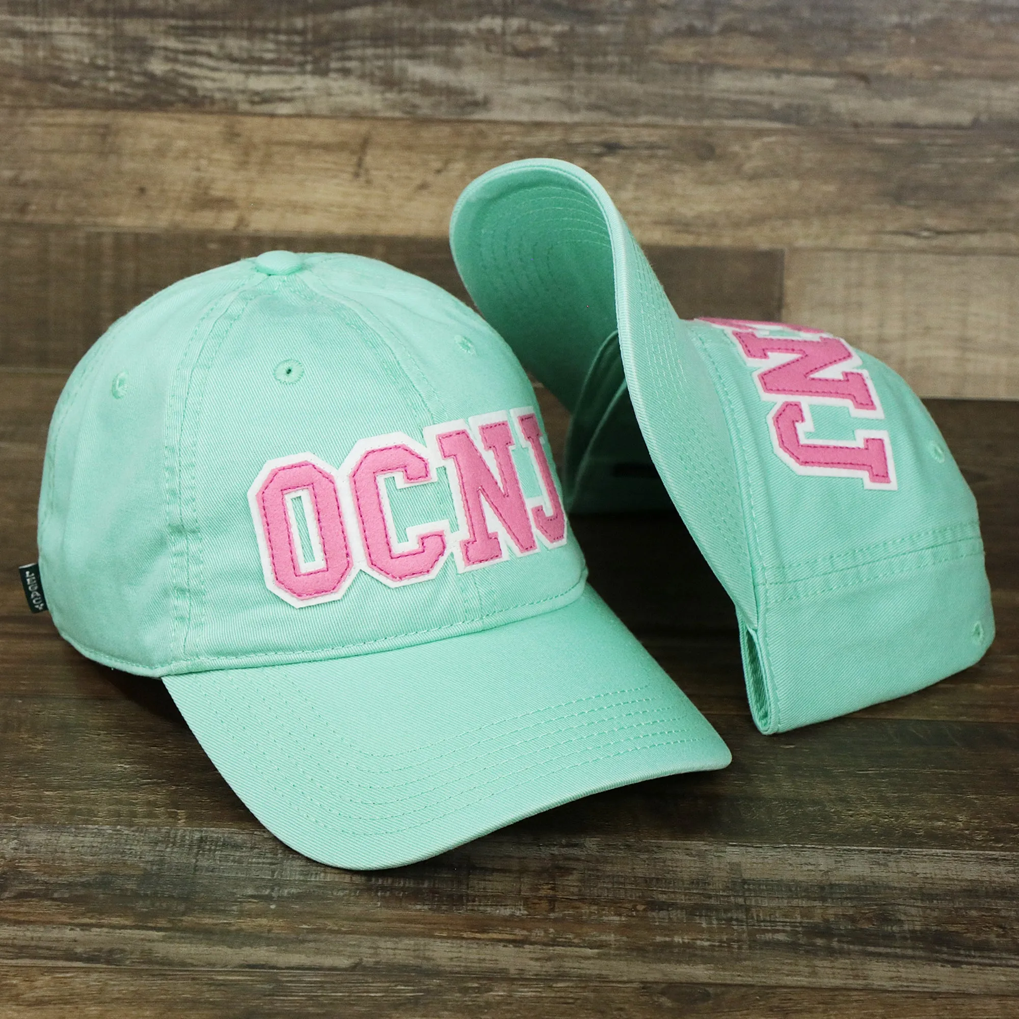 Youth Pink OCNJ Wordmark White Outline Dad Hat | Spearmint Youth Dad Hat